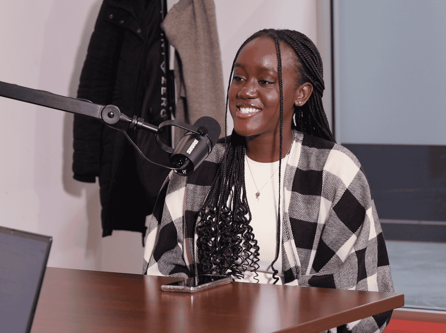 A young guest speaking into a microphone at a Young Eye recording